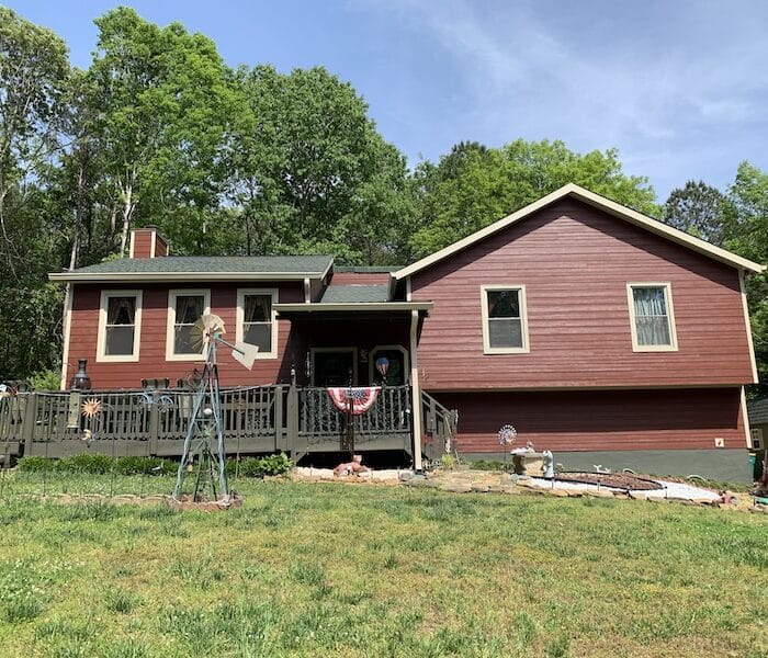 Remodeling Masters red siding installation